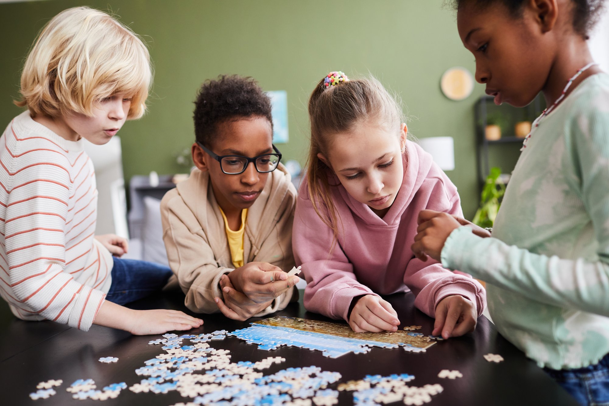 young children playing with puzzle