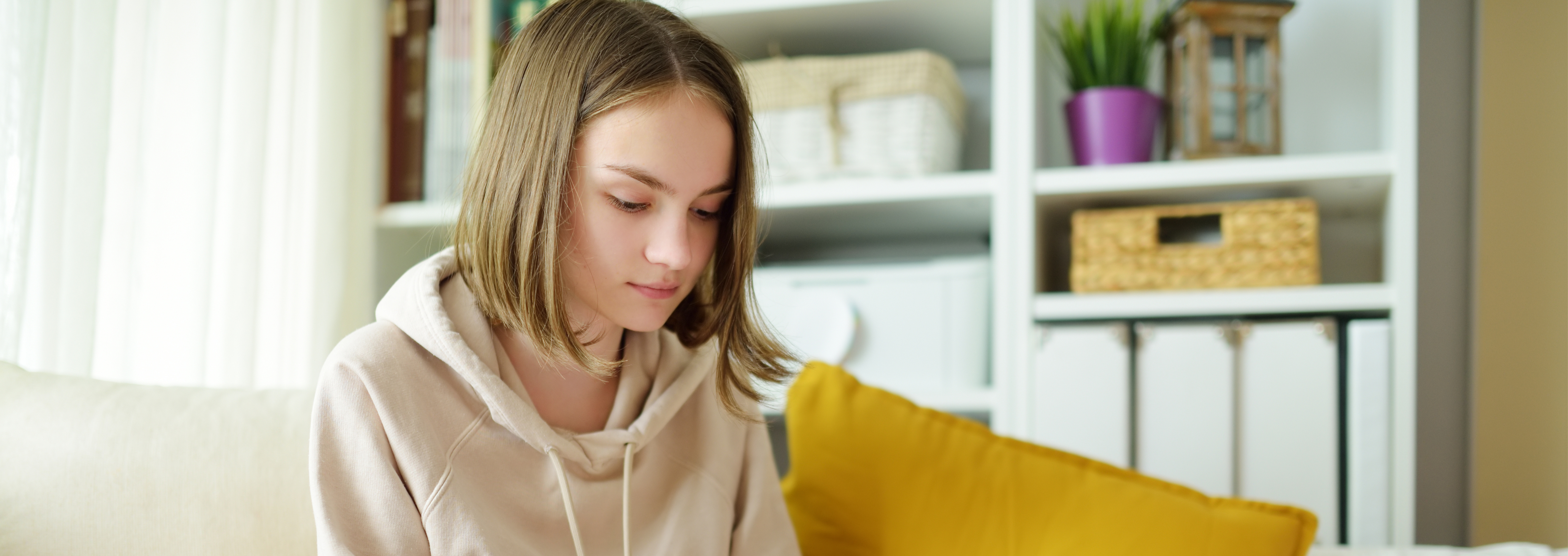 Young girl sitting on couch