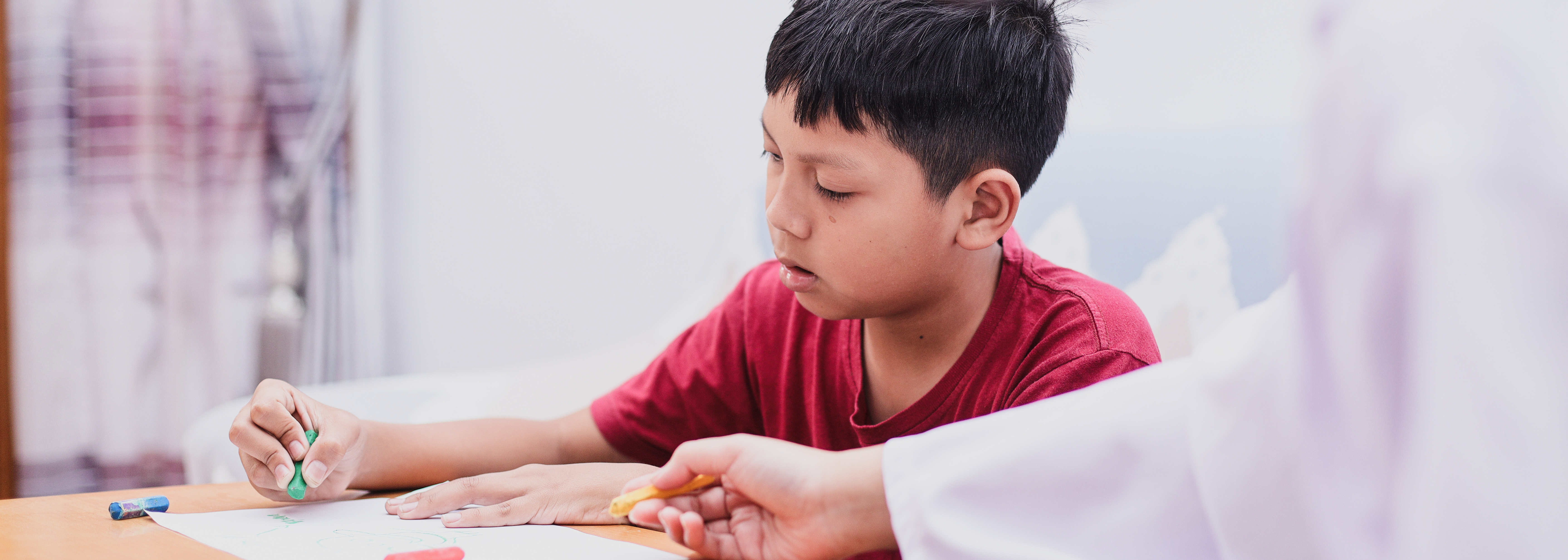 Young boy coloring